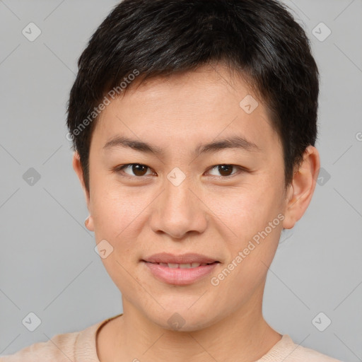 Joyful asian young-adult male with short  brown hair and brown eyes