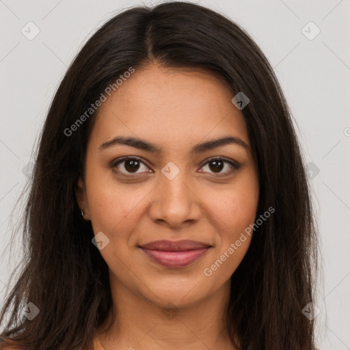 Joyful latino young-adult female with long  brown hair and brown eyes