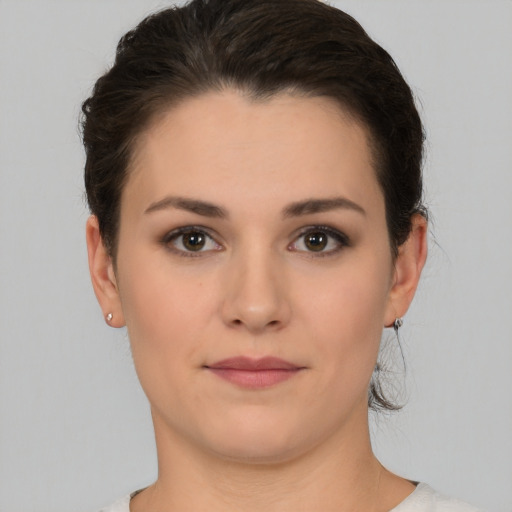 Neutral white young-adult female with short  brown hair and brown eyes