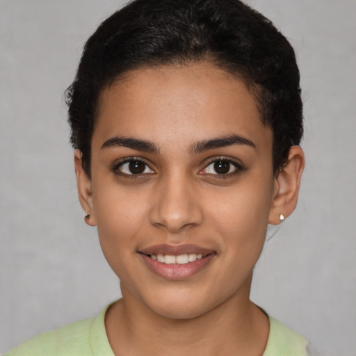 Joyful latino young-adult female with short  brown hair and brown eyes