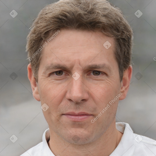 Joyful white adult male with short  brown hair and grey eyes