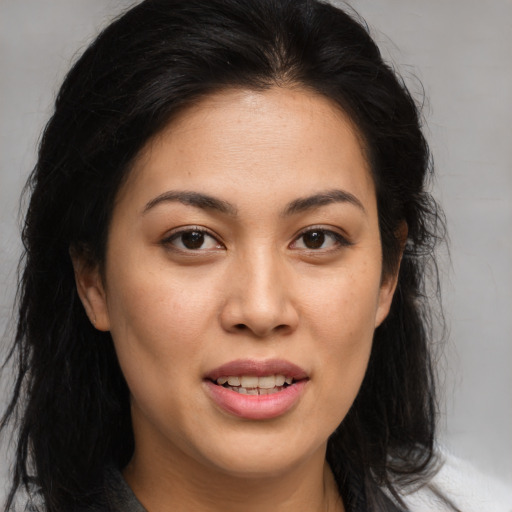 Joyful asian young-adult female with medium  brown hair and brown eyes