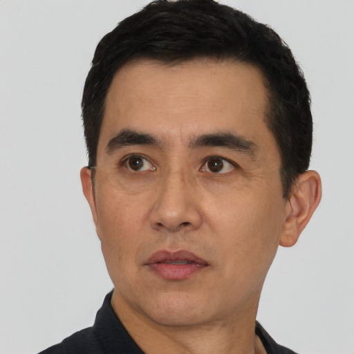 Neutral latino adult male with short  black hair and brown eyes