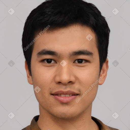 Joyful asian young-adult male with short  black hair and brown eyes