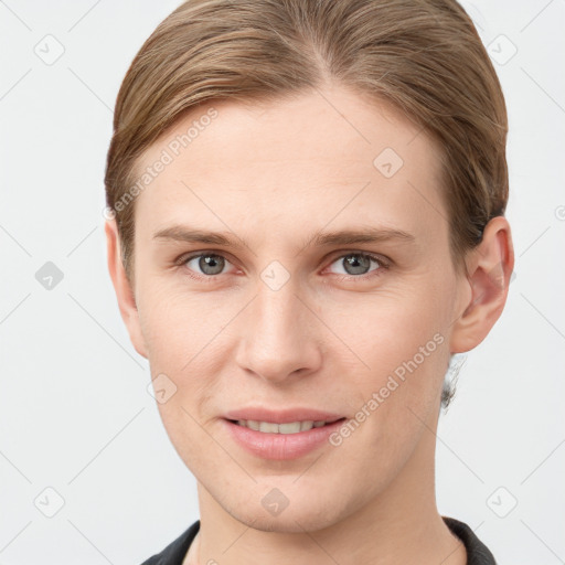 Joyful white young-adult female with short  brown hair and grey eyes