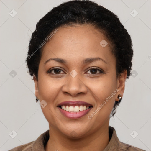 Joyful latino young-adult female with short  brown hair and brown eyes