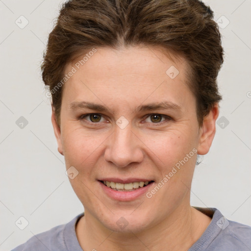 Joyful white young-adult female with short  brown hair and grey eyes