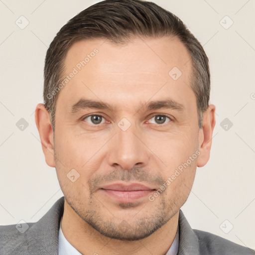 Joyful white adult male with short  brown hair and brown eyes