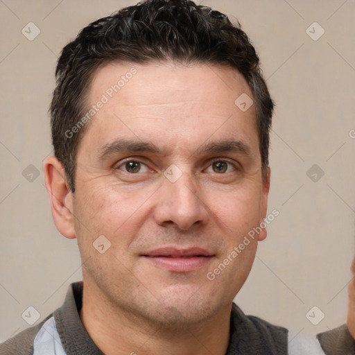 Joyful white adult male with short  brown hair and brown eyes