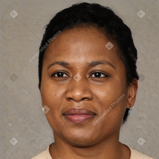 Joyful black adult female with short  brown hair and brown eyes