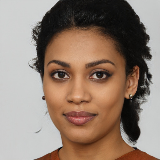 Joyful latino young-adult female with medium  black hair and brown eyes