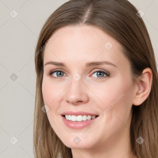 Joyful white young-adult female with long  brown hair and blue eyes