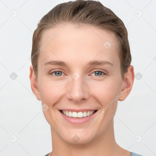 Joyful white young-adult female with short  brown hair and grey eyes