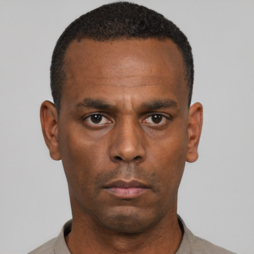 Neutral black adult male with short  black hair and brown eyes