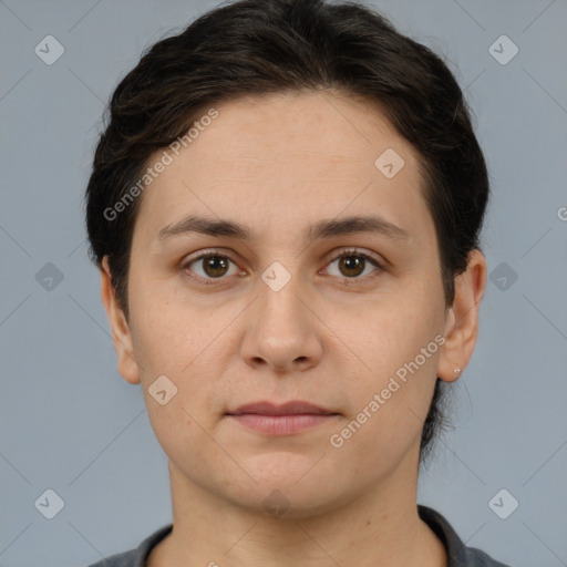 Joyful white young-adult female with short  brown hair and brown eyes