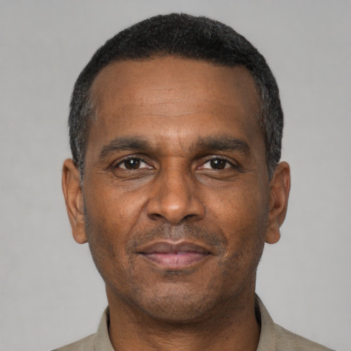 Neutral black adult male with short  black hair and brown eyes