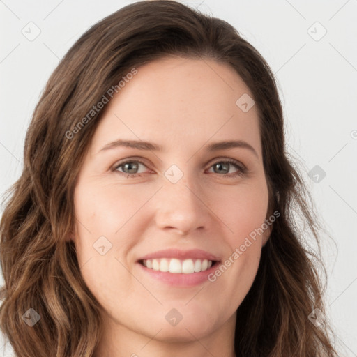 Joyful white young-adult female with long  brown hair and green eyes