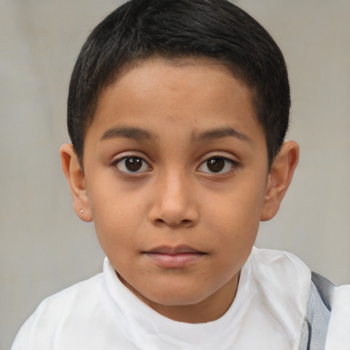 Joyful latino child female with short  brown hair and brown eyes