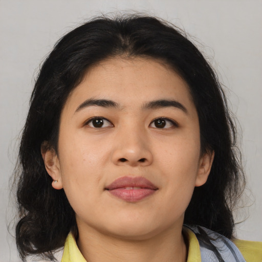 Joyful asian young-adult female with medium  black hair and brown eyes