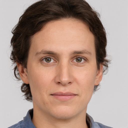 Joyful white young-adult male with medium  brown hair and brown eyes