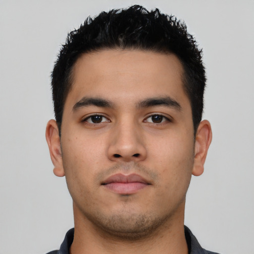 Neutral latino young-adult male with short  black hair and brown eyes