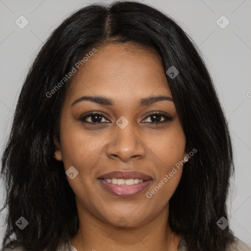 Joyful black young-adult female with long  brown hair and brown eyes