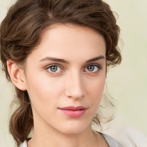 Neutral white young-adult female with medium  brown hair and green eyes