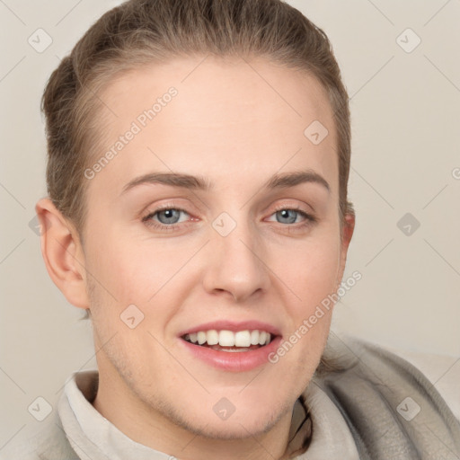 Joyful white young-adult female with short  brown hair and grey eyes