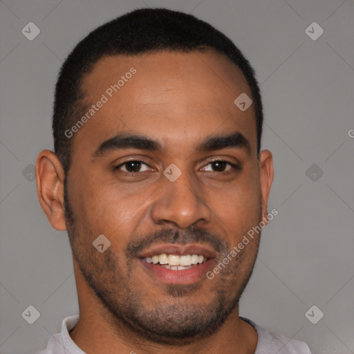 Joyful black young-adult male with short  brown hair and brown eyes