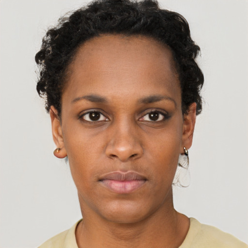 Neutral black young-adult female with short  brown hair and brown eyes