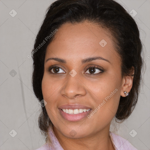 Joyful latino young-adult female with medium  brown hair and brown eyes