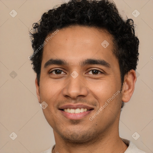 Joyful latino young-adult male with short  brown hair and brown eyes