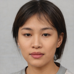 Neutral asian young-adult female with medium  brown hair and brown eyes