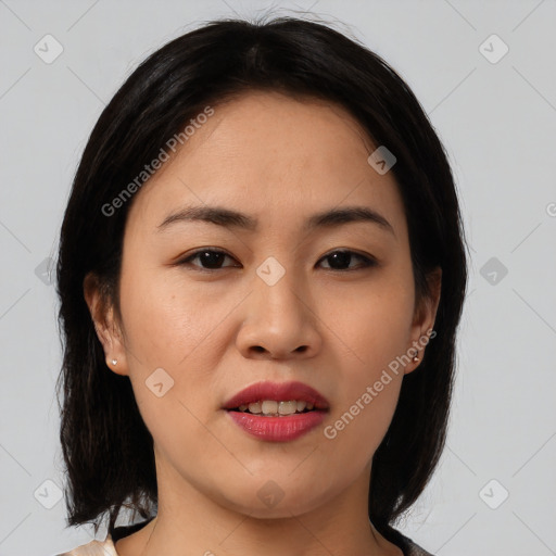 Joyful asian young-adult female with medium  black hair and brown eyes