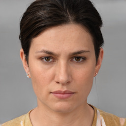 Neutral white young-adult female with short  brown hair and brown eyes