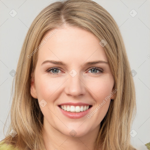 Joyful white young-adult female with medium  brown hair and green eyes