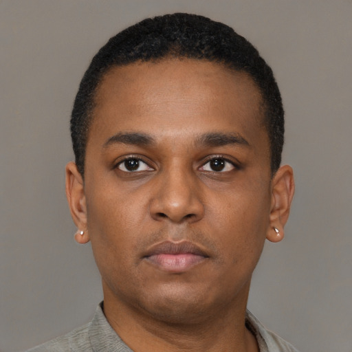 Neutral black young-adult male with short  black hair and brown eyes