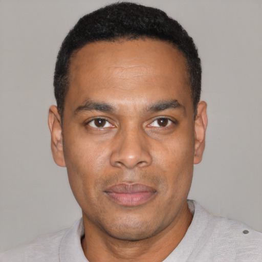 Neutral black young-adult male with short  black hair and brown eyes