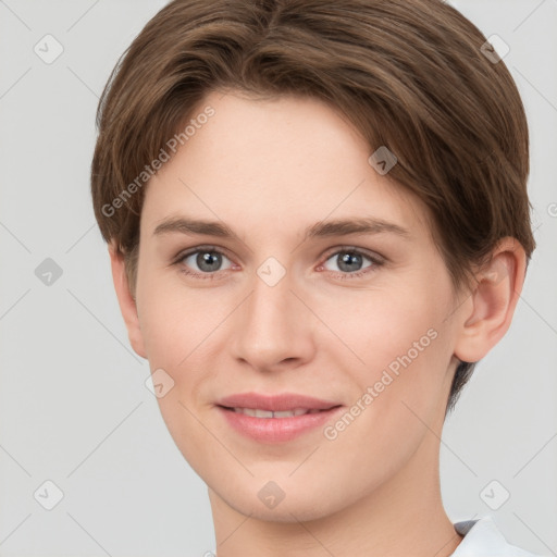 Joyful white young-adult female with short  brown hair and grey eyes