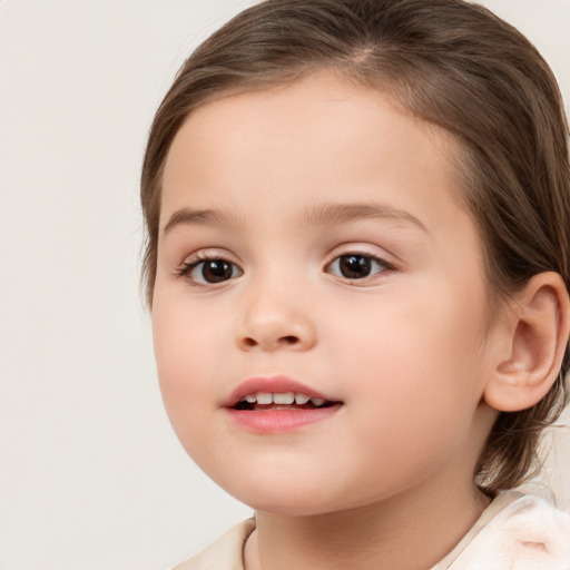 Joyful white child female with medium  brown hair and brown eyes