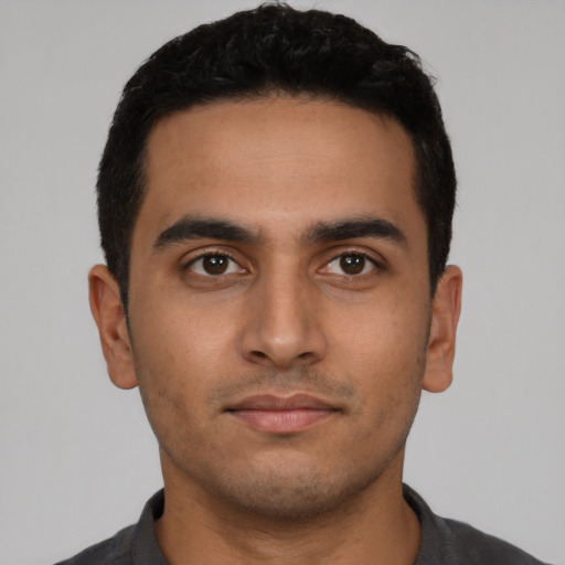 Neutral latino young-adult male with short  black hair and brown eyes