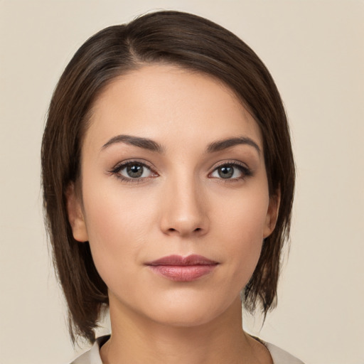 Neutral white young-adult female with medium  brown hair and brown eyes