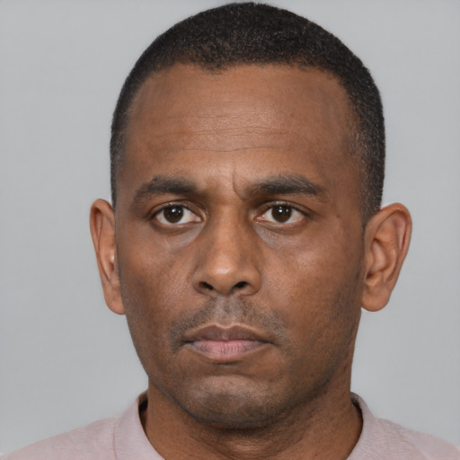 Neutral black adult male with short  black hair and brown eyes