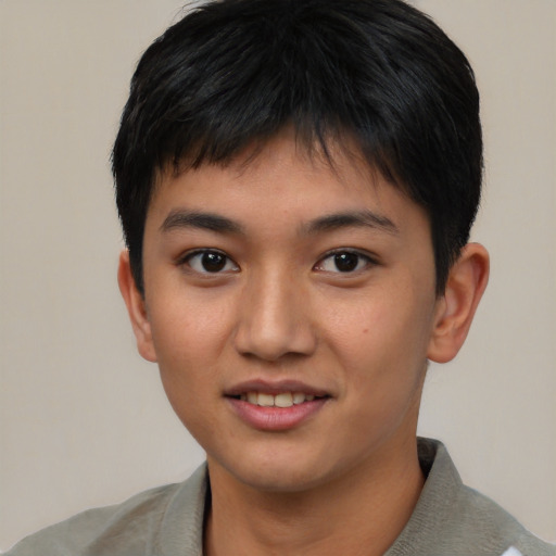 Joyful asian young-adult male with short  brown hair and brown eyes
