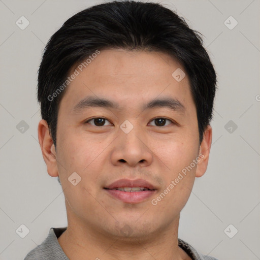 Joyful asian young-adult male with short  brown hair and brown eyes