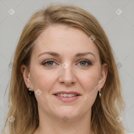 Joyful white adult female with long  brown hair and grey eyes