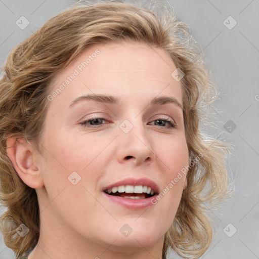 Joyful white young-adult female with medium  brown hair and blue eyes