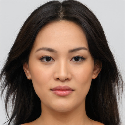 Joyful asian young-adult female with medium  brown hair and brown eyes