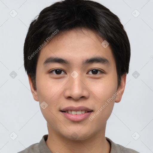 Joyful white young-adult male with short  black hair and brown eyes