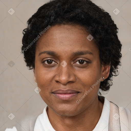 Joyful black adult female with short  brown hair and brown eyes